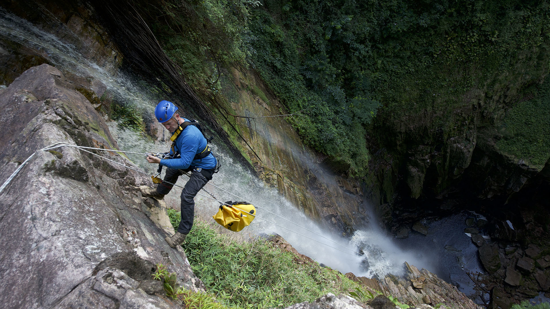 Image of Steve Backshall abseiling.