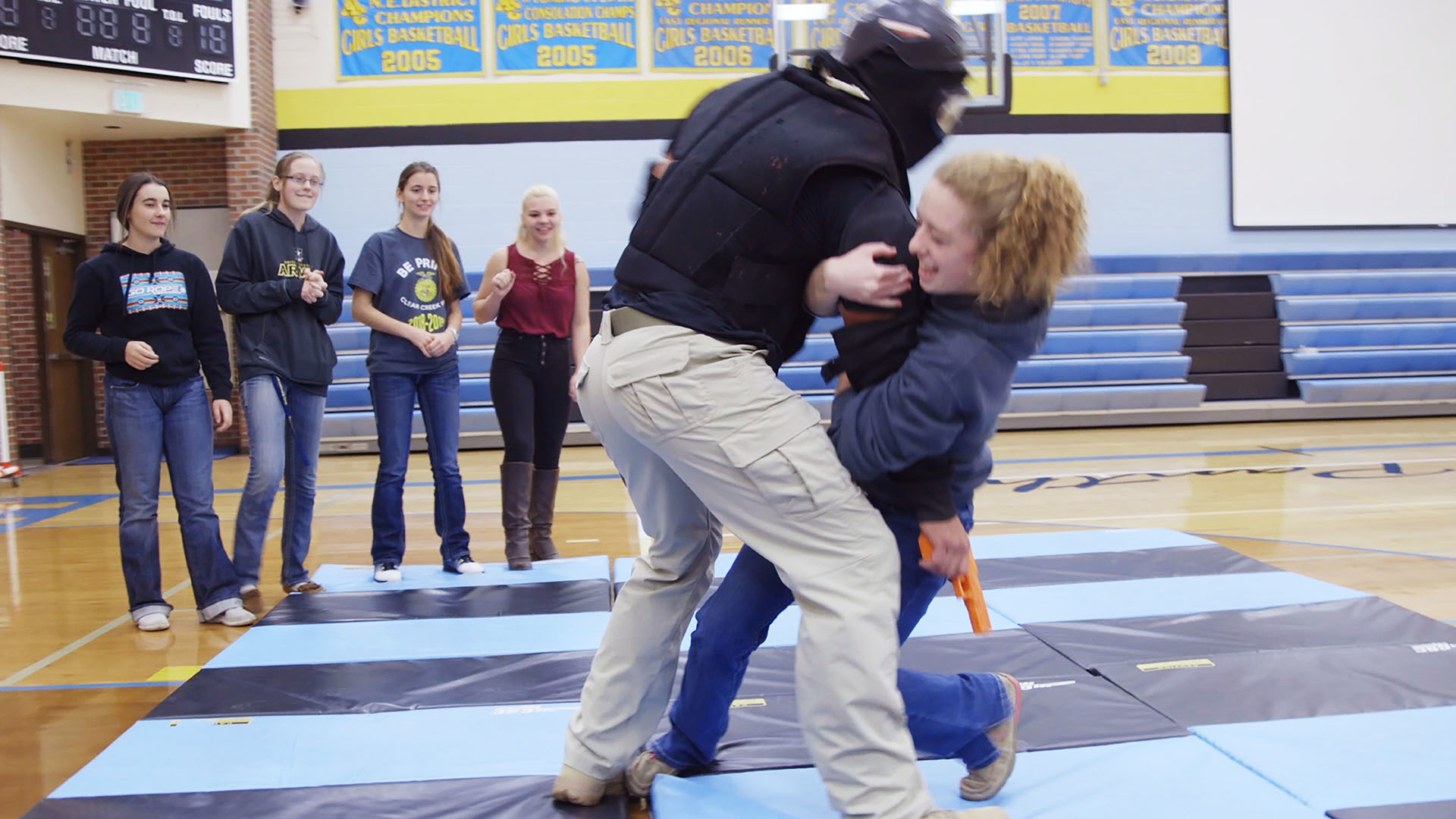The drills we observed in Wyoming increased in escalation as the students got older. Here, a high school student was asked to practice tackling a trainer armed with a fake gun.
