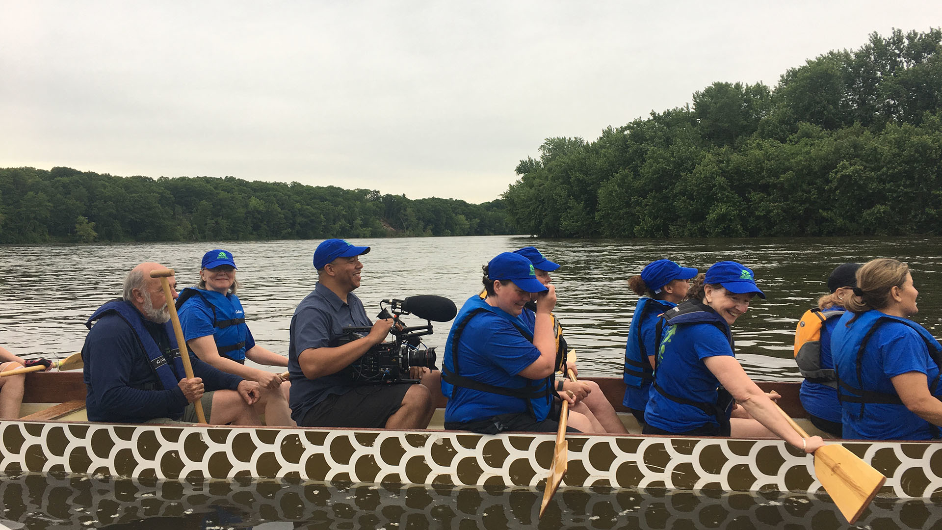 Cinematographer Corey Lillard films the Paradise City Dragon Boat team from inside the boat.