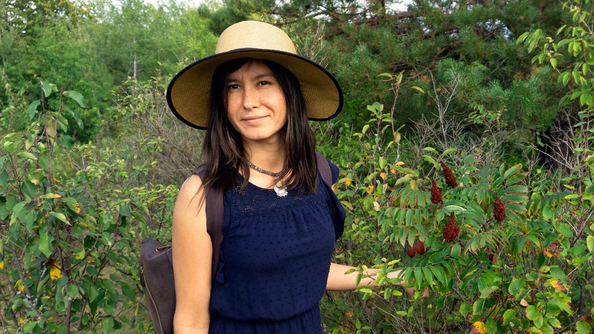 Tashia Hart harvesting sumac