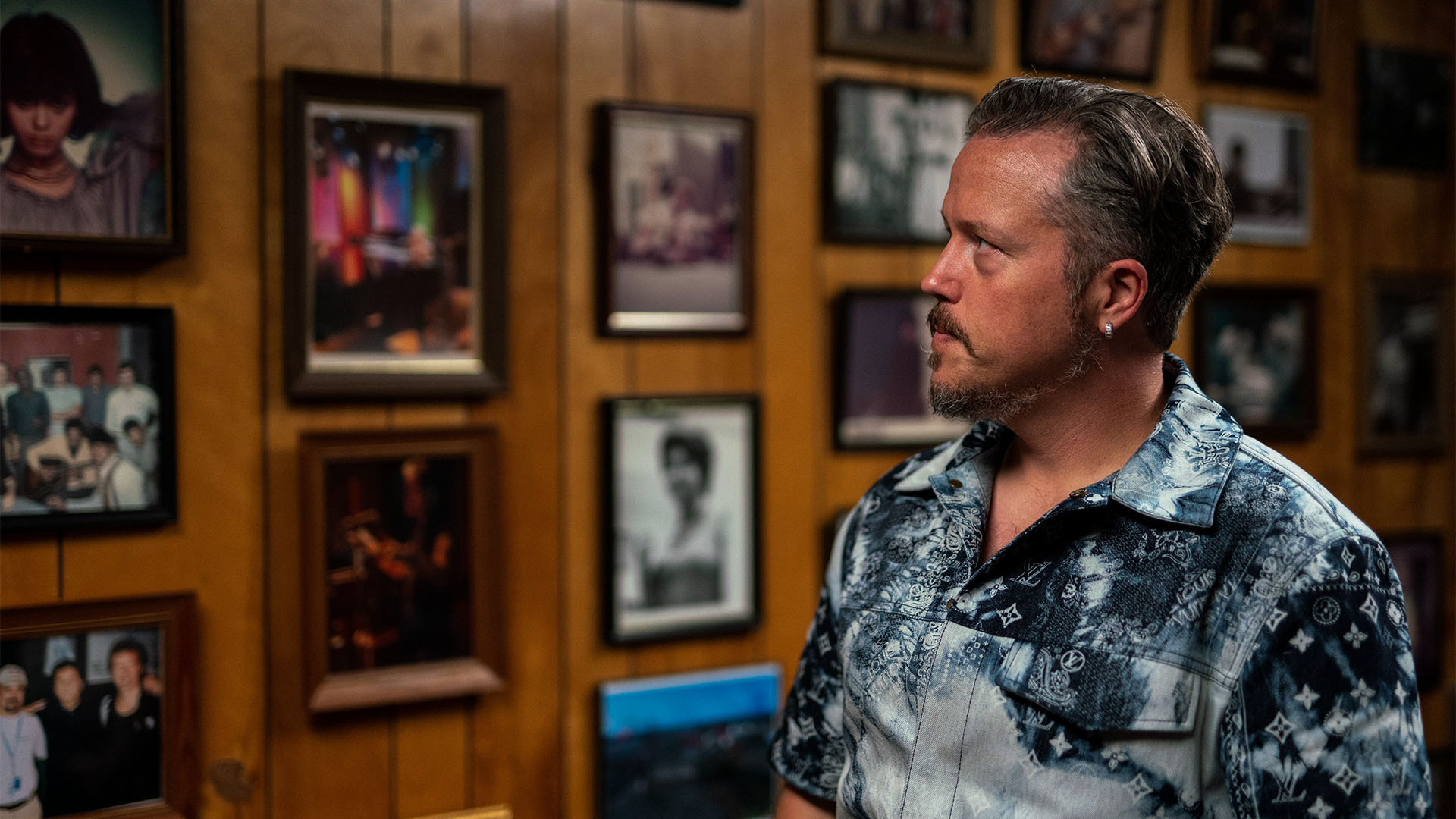 Musician Jason Isbell looks at photos at Fame Recording Studios in Muscle Shoals, Alabama.