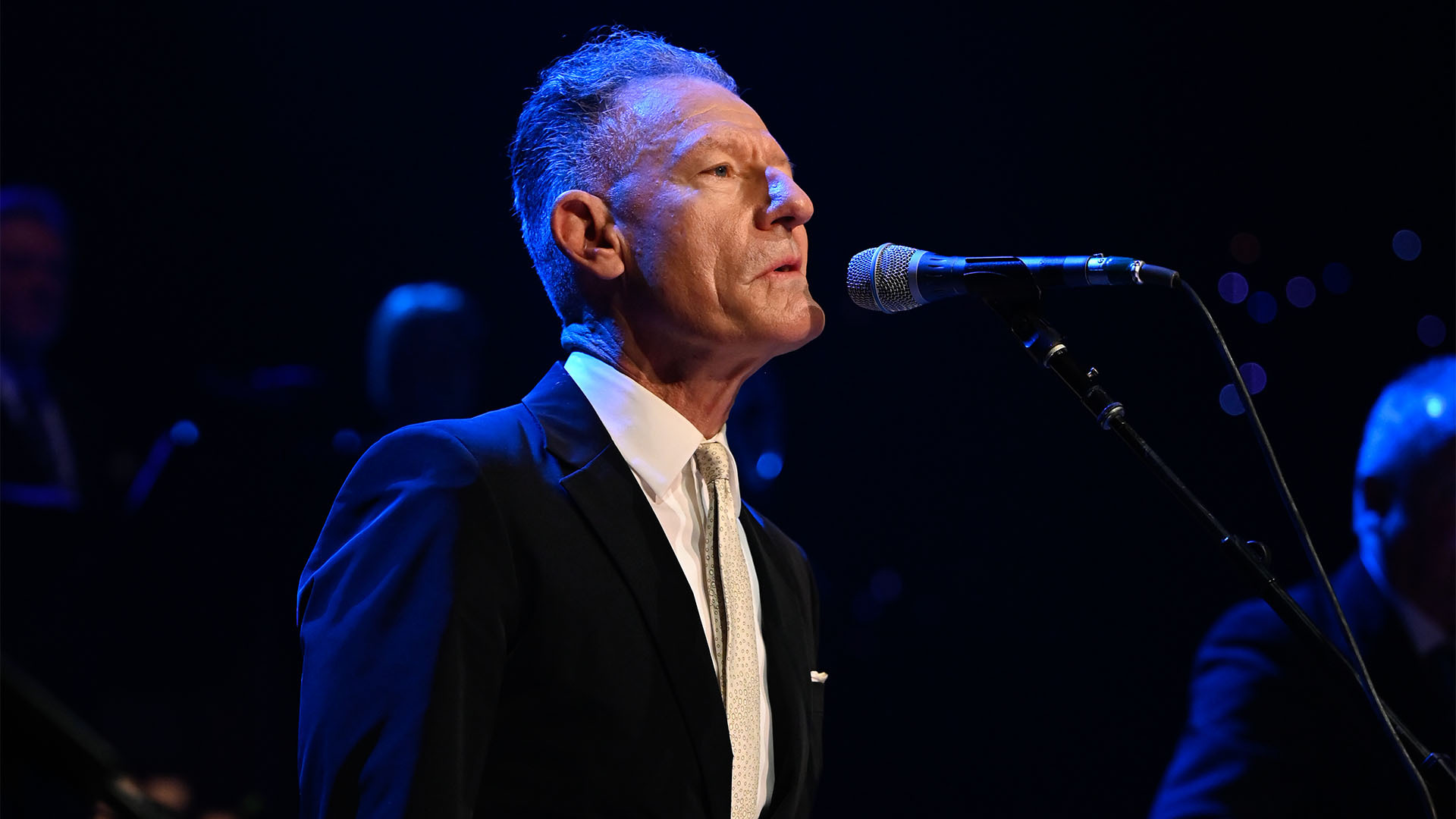 Lyle Lovett stands in front of a mic and performs live at Austin City Limits in Austin, Texas.